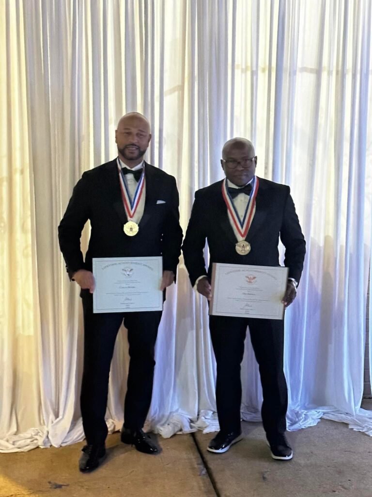 Dee Brown and Carlos Moore Honored with President’s Lifetime Achievement Award for Exemplary Service